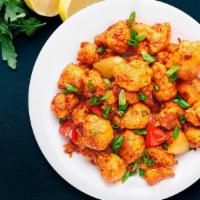 Authentic Gobi Manchurian · Batter fried cauliflower pieces tossed and coated in tangy garlic sauce.