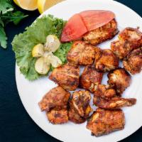 Unbeatable Chicken Tikka Kebab · Grilled chicken thigh meat cubes marinated in roasted red chili, yogurt, Indian masalas. Ser...