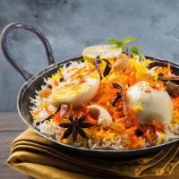 FB's Guddu (Egg) Biryani · A seasoned mixture of egg and basmati rice served with raita and mirchi-ka-salan.