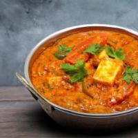 Kadai Paneer Curry · Indian cheese cubes cooked with diced peppers and sautéed Kadai masala.
