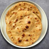 Tandoori Roti Rotation · Whole wheat flat bread baked in an Indian clay oven.