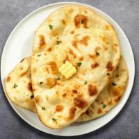 Plain Jane Naan · Freshly baked bread in a clay oven