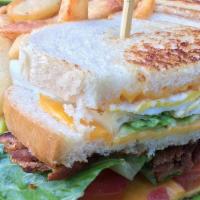 Lou's Club Sandwich · Triple stacked, bacon, cheese, fried egg, lettuce, tomato.