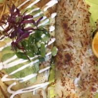 California Crepe · Ham, bacon, mushrooms, green onion avocado and Swiss cheese topped with our cream and chives.