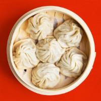 Chicken Dumpling Soup · 6 steamed dumplings filled with soup broth and ground chicken.