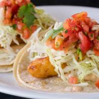 Baja Taco · fried fish with chipotle crema, cabbage cilantro, salsa fresca, and lime