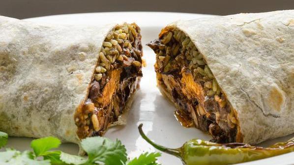 Specialty Mole Burrito · mole poblano sauce with choice of chicken or pork, rice, whole beans, pickled onions and jalapenos