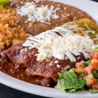Enchiladas · 2 hand made corn tortilla enchiladas, red chile ancho or green tomatillo sauce, with crema a...