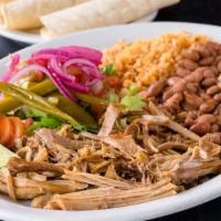 Plato de Carnitas · slow cooked pork served with salsa fresca, grilled onions, chiles toreados, and tortillas