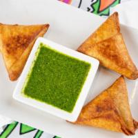 Samosa (Lentil) · Triangles shaped pastry shells (made in-house by lemat) stuffed with lentil, onion jalapeño ...