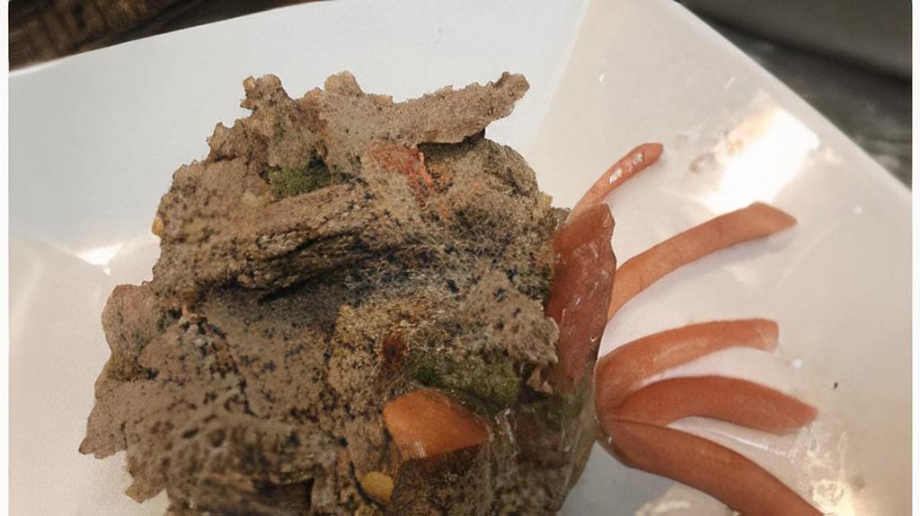 Timatim Fitfit · Roll of injera scrambled in a blend of fresh tomato, jalapeños spring onions, lime juice and, topped off with lemat fresh exotic herbs.