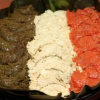 Lemat Kitfo · Special kitfo served with Ethiopian style lemat homemade cottage cheese and collard green ki...