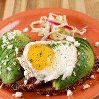 Avocado Egg Toast · Toasted rustic French bread, soffritto, avocado, goat cheese, spicy cabbage slaw.