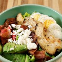 Cobb Salad · romaine lettuce, tomato, avocado, chicken, bacon, hard boiled egg, feta cheese and a butterm...
