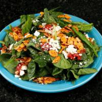 Spinach Salad · Fresh spinach, roasted tomatoes, spiced almonds, and goat cheese, with balsalmic vinaigrette.