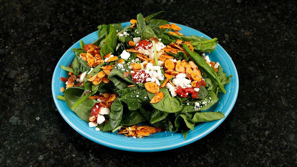 Spinach Salad · Organic baby spinach, apples, feta cheese, spiced almonds and balsamic dijon vinaigrette