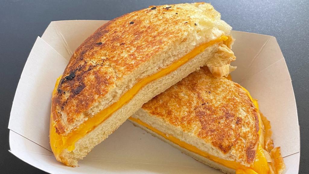 Grilled Cheese · American cheese melted on a toasted bun