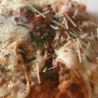 Chicken Parmesan · Breaded chicken breast, melted Provolone cheese, marinara, served with penne pasta and marin...