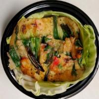 Pajeon · Korean style pancake, green onion with seafoods. Comes with 3 side dishes, changing daily.