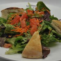 Insalata Mista · Fresh green mixed salad served with balsamic vinaigrette.