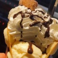Churrito · Mini churro, vanilla ice cream, whip, chocolate drizzle, pocky stick.