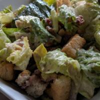 Chicken Caesar · Warm slices of grilled chicken, romaine hearts, parmesan cheese & croutons. Tossed in (ancho...