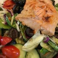 Salmon Salad · Broiled salmon, mixed greens, topped with red onions, blue cheese crumbles & artichoke heart...