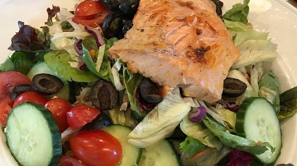 Salmon Salad · Broiled salmon, mixed greens, topped with red onions, blue cheese crumbles & artichoke hearts. Served with your choice of dressing.