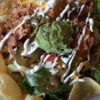 Taco Salad · Grilled chicken, avocado, tomato, combo cheese, chives, assorted tortilla chips & romaine he...