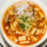 Hot & Sour Soup · Szechuan. Hong Kong. Rich chicken broth with bamboo shoot, shredded pork and Chinese black m...