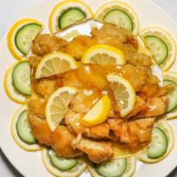 Lemon Chicken · Hong Kong. Tender breast meat deep fried then covered with rich lemon sauce, served on bed o...