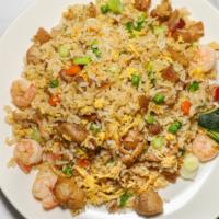 Fried Rice · Rice, chopped onion, eggs, green peas with a light soy sauce.