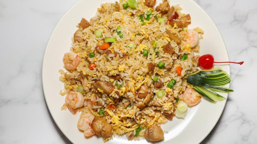 Fried Rice · Rice, chopped onion, eggs, green peas with a light soy sauce.