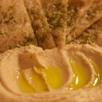 Hummus · with house-made pita & za'atar.