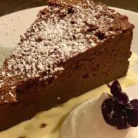 Flourless Chocolate Cake with Cocoa Nib Toffee Whipped Cream · 