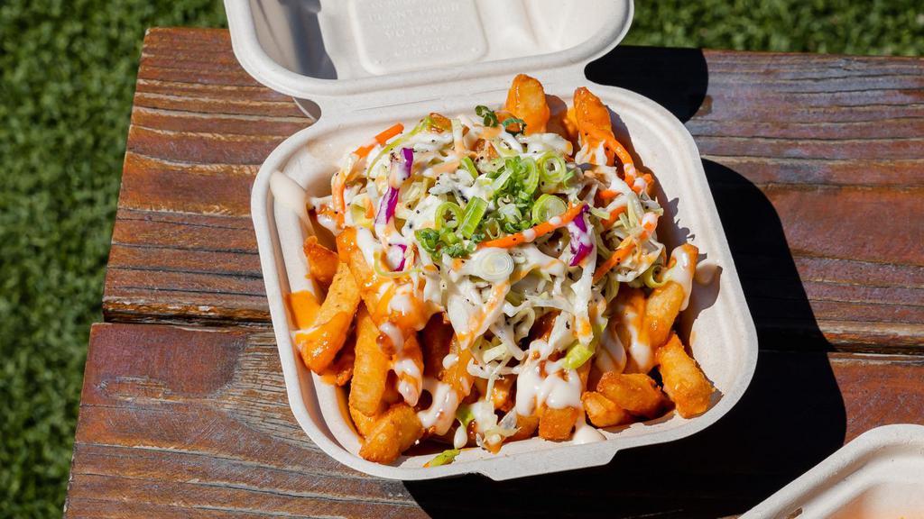Dirty Style French Fries · Crispy and lightly seasoned fries topped with slaw, aioli, and house-made spicy AHY! sauce.