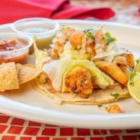 Fajitas Nikko Prawns (plate) · Grilled shrimp or fish with roasted peppers and onions served with four or com tortillas, so...