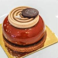 Harmony · A pralin crust with a dark chocolate brownie, a dome of milk chocolate mousse all topped  by...