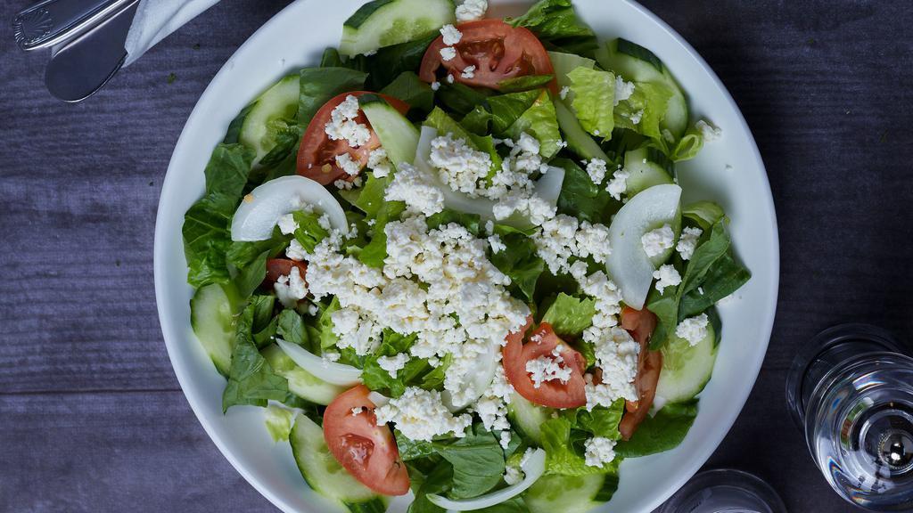 Greek Salad · Romain Lettuce, tomato, onion, cucumber, black olive, Feta cheese with Italian dressing.