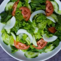 House salad · Romain heart lettuce, tomato, onion, cucumber with Olive oil and vinegar dressing