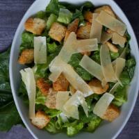 Caesar Salad  · Romain Lettuce, crotons shaved parmesan cheese with Caesar dressing.