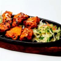 Chicken Tikka Tandoori · Five to six tender chicken marinated with yogurt, chopped garlic, and fresh ground spices th...
