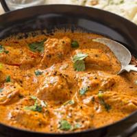 Chicken Curry · Marinated boneless chicken served in a traditional tomato and onion based curry.