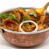 Lamb Curry · Marinated boneless lamb served in a traditional tomato and onion based curry.