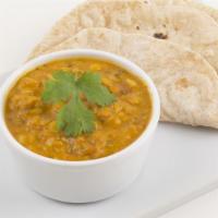 Daal Makhani · Black lentils slow stewed with fresh ground traditional spices.