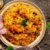 Chicken Biryani · Fresh made basmati rice prepared with fresh spices and loaded with tender marinated chicken.