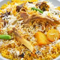 Goat Biryani · Fresh made basmati rice prepared with fresh spices and loaded with tender marinated goat.