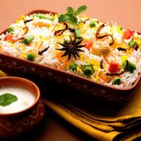 Vegetable Biryani · Fresh made basmati rice prepared with fresh spices and loaded with locally grown veggies.