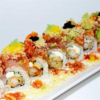 **Las Vegas Roll · Soft shell crab, macadamia nut, cream cheese, asparagus topped with
mixed fish w/crab stick,...