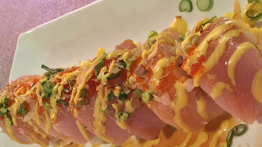 **James Special · Spicy imitation crab, cucumber, avocado wrapped white tuna, green onion, tobiko, fish flake and mustard sauce.
